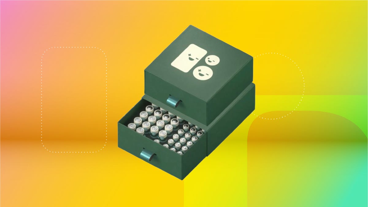 Green battery pack against yellow and green gradient.