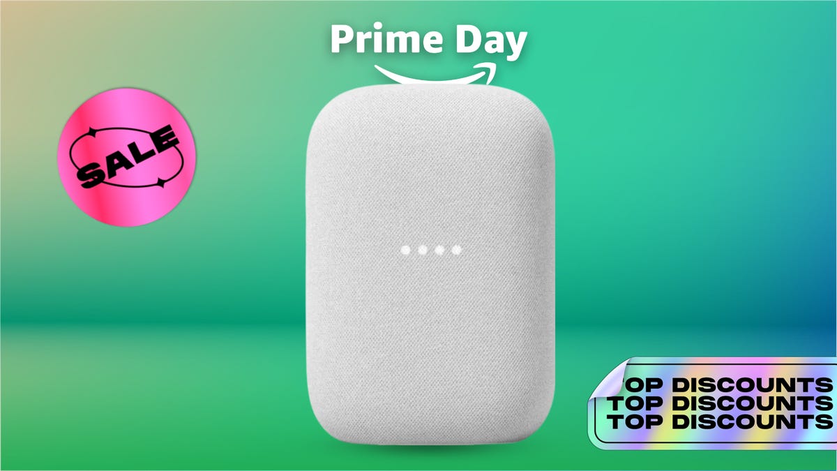 Google Nest Audio smart speaker on a green background