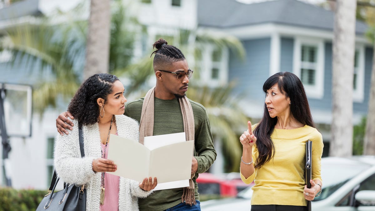 A real estate agent gives tips to a couple looking to buy a home in today's tough market.