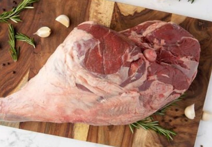leg of lamb on cutting board