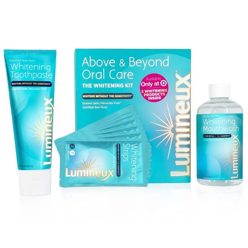The Lumineux teeth whitening kit including toothpaste and mouthwash over a white background.