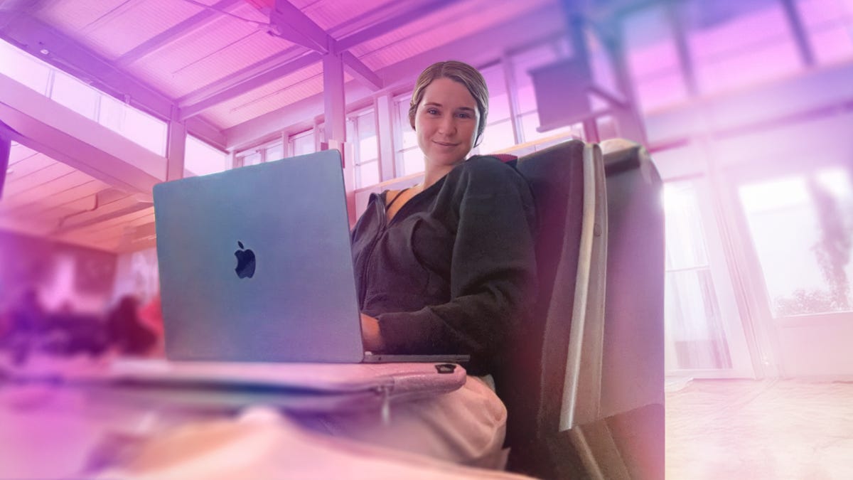 Author Faith sat in front of a MacBook while using a VPN