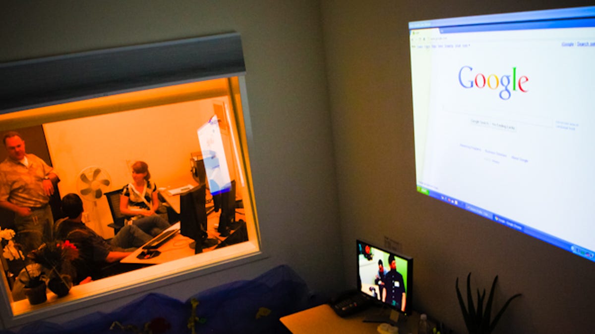 Google's John Boyd (standing) and LaDawn Jentzch, user experience researchers at Google, explain to CNET's Tom Krazit how Google's usability lab works, as seen from the observation room.