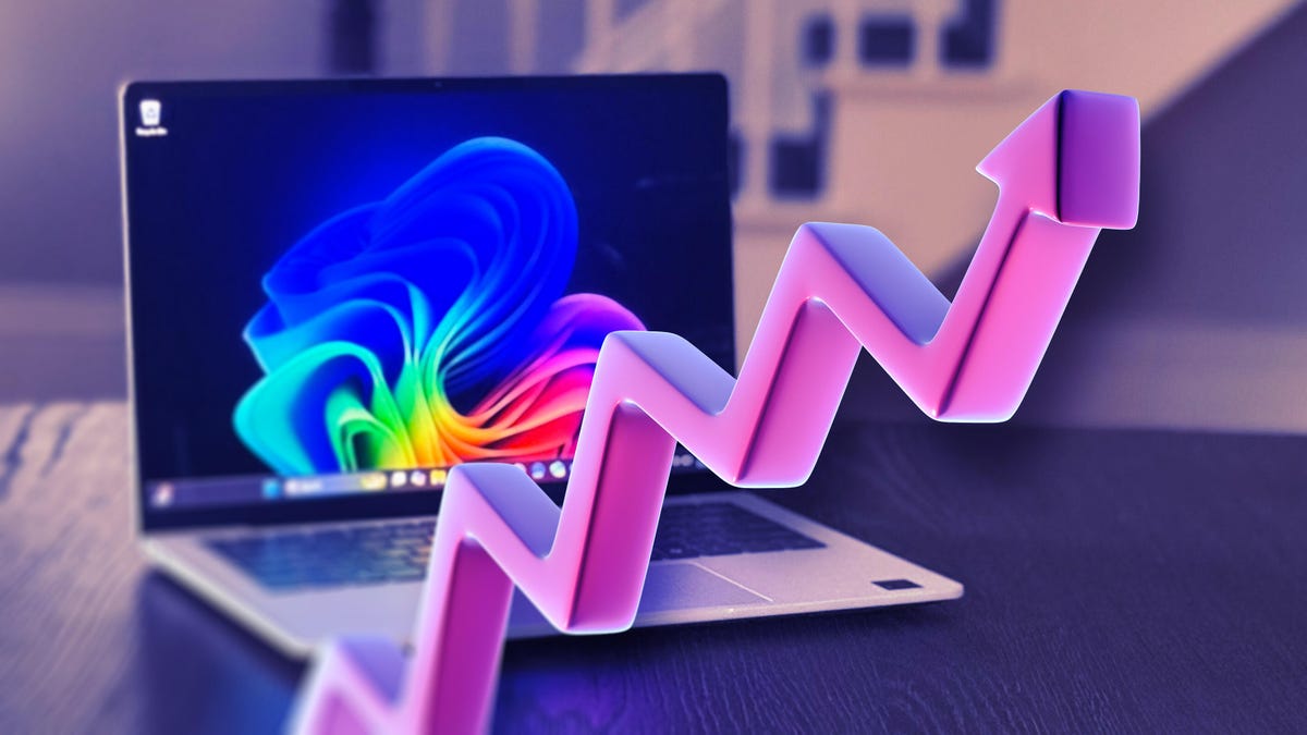 Laptop with rising purple arrow