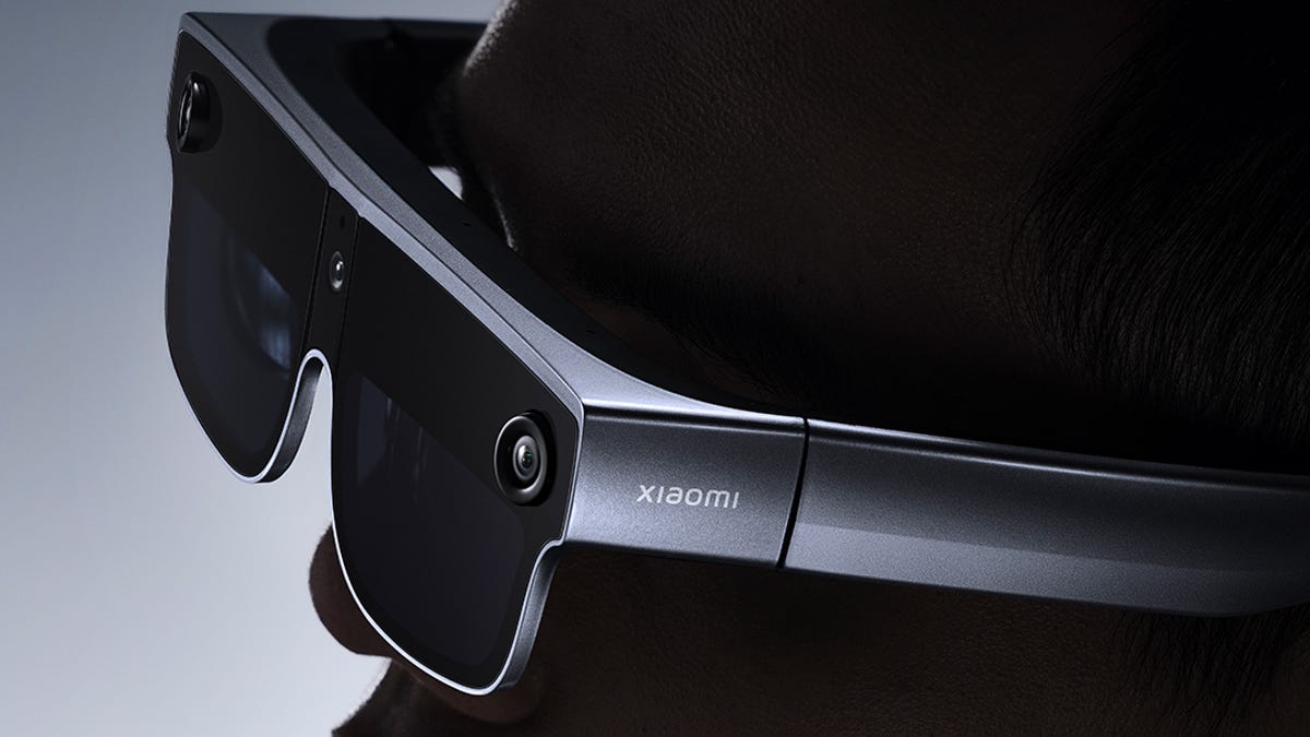 Silhouette of a person wearing futuristic grey camera sunglasses by Xiaomi