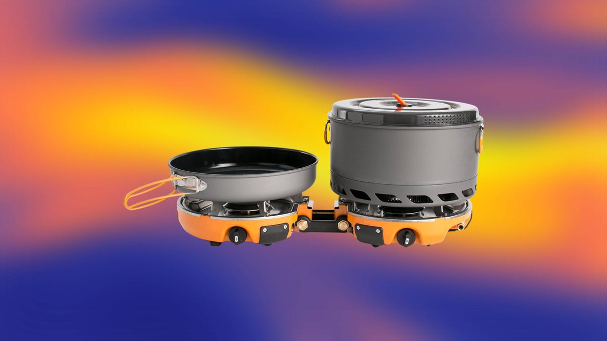 A two-burner camp stove with a pot and pan against an abstract blue and orange background.