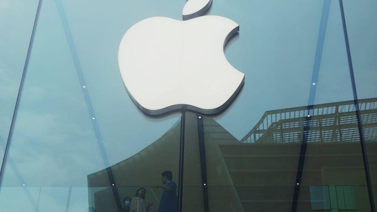 Apple's company logo is seen on a building in China