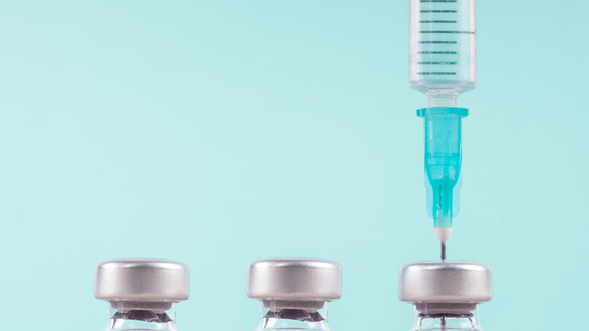 Three vaccines against a light blue background