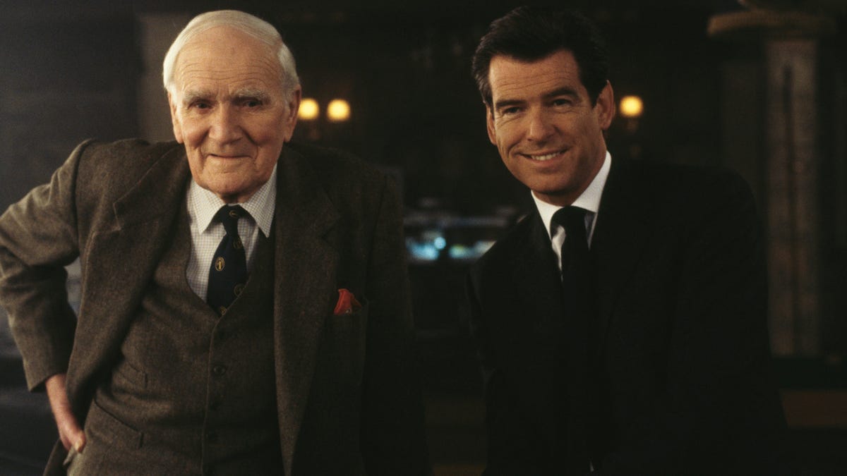Desmond Llewellyn as Q and Pierce Brosnan as James Bond