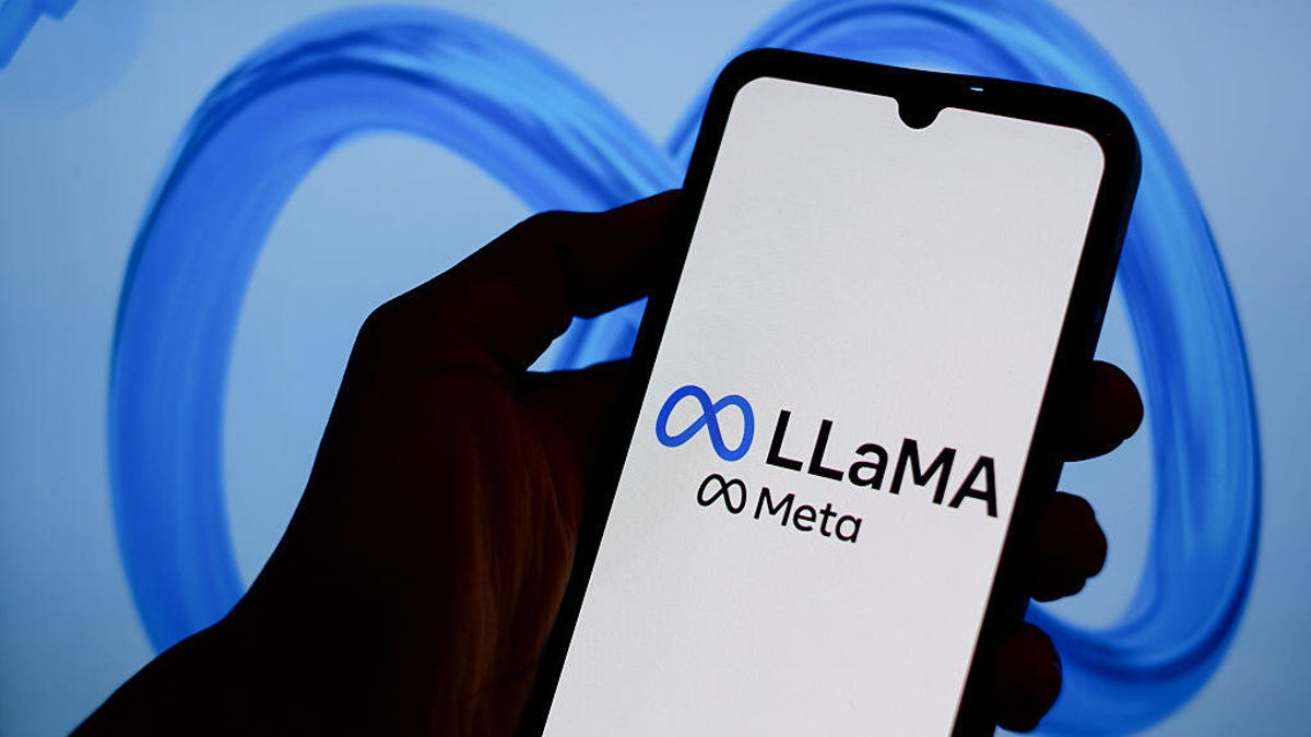 Meta Llama logo on smartphone behind blue Meta logo
