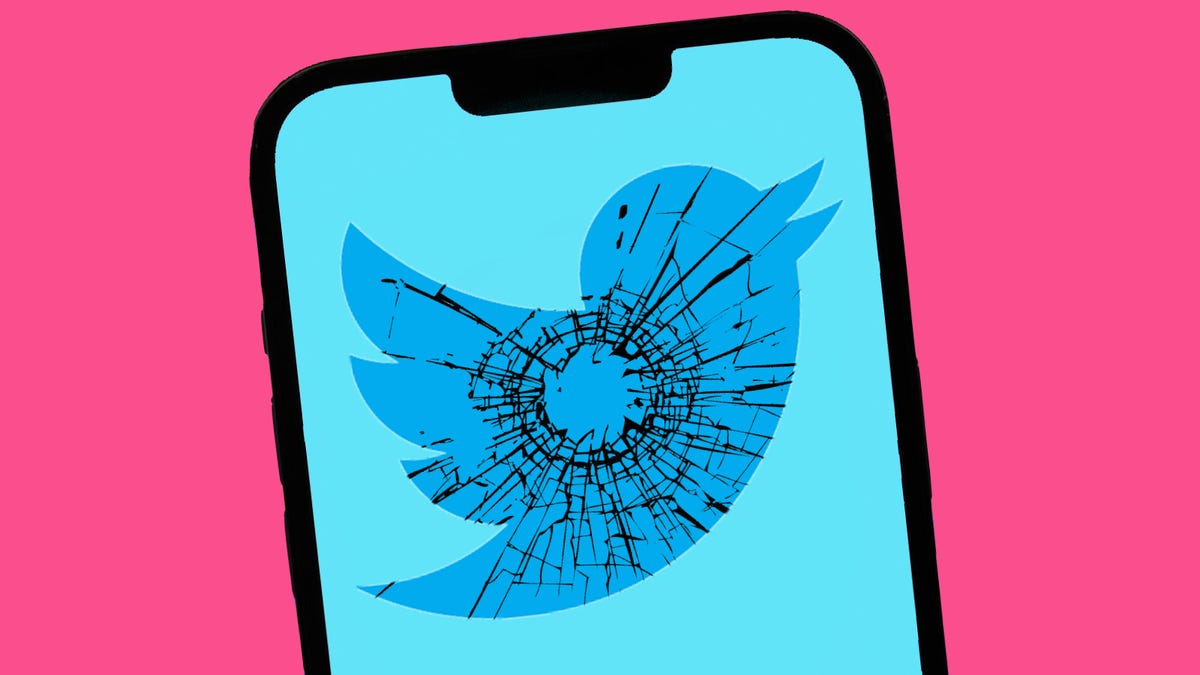A phone shows Twitter's bird logo, with imagery of a gunshot shattering glass