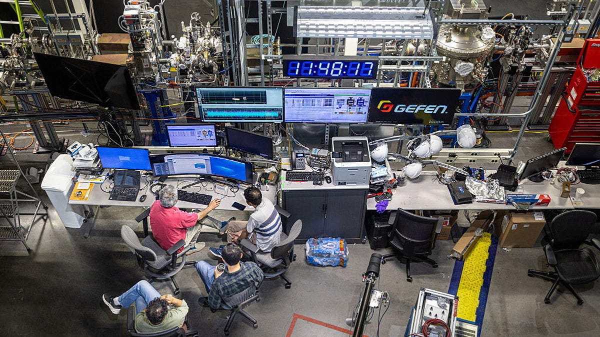 Scientists work at equipment in Brookhaven National Laboratory.