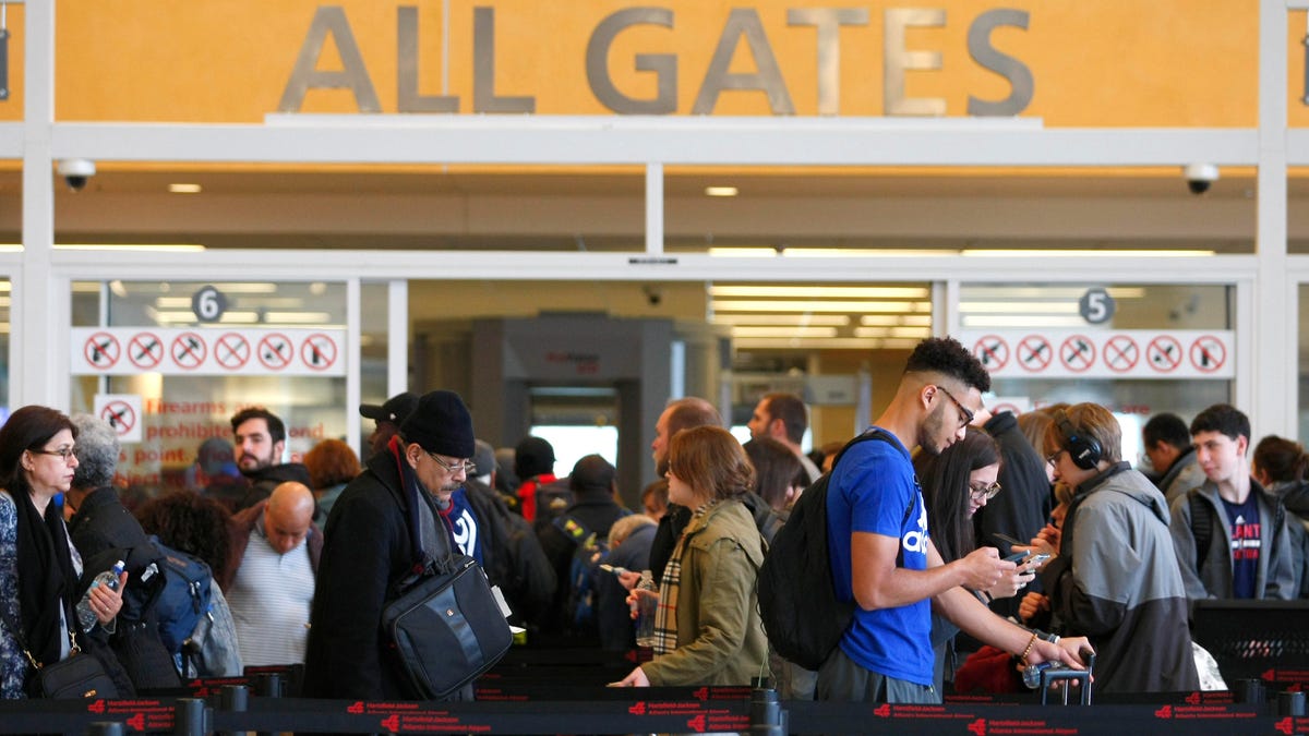 Travelers line up at Atlanta's airport