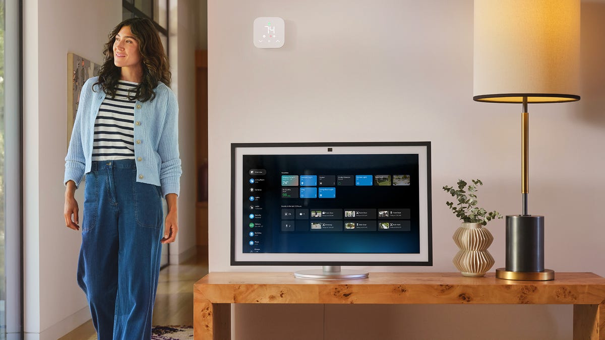 woman walking near an amazon echo display