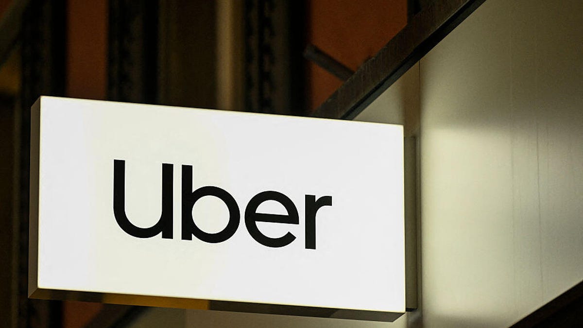 White and black Uber sign is shown