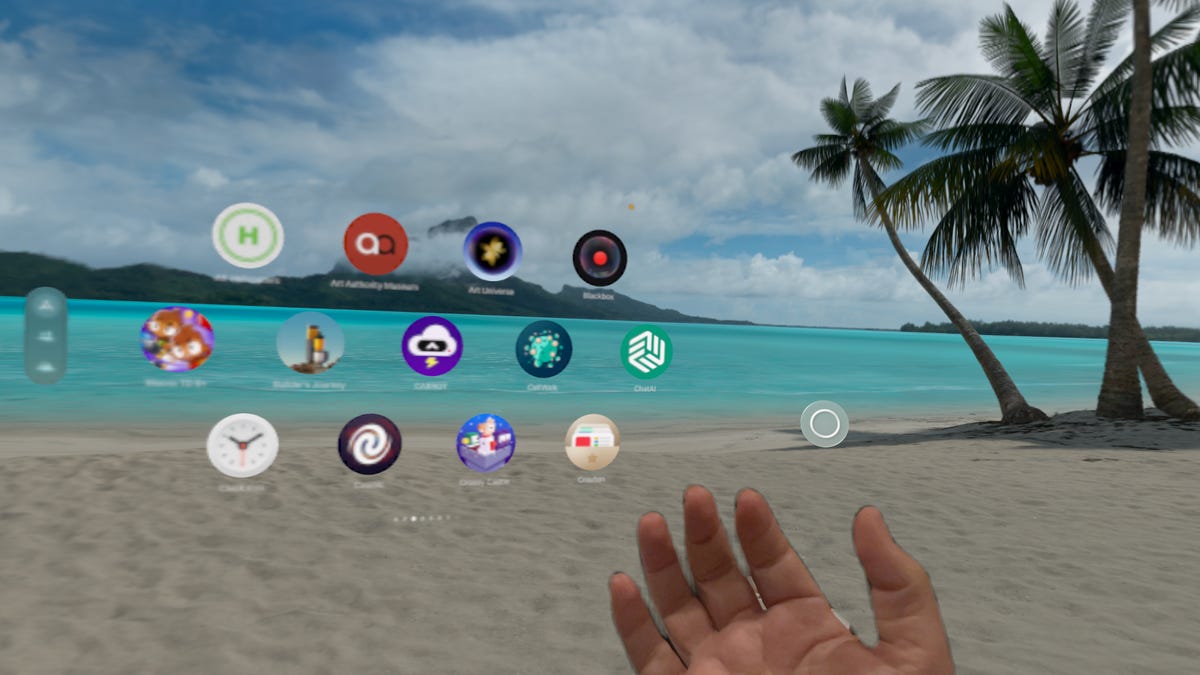 A hand reaching out on a virtual beach with a grid of apps in front of it