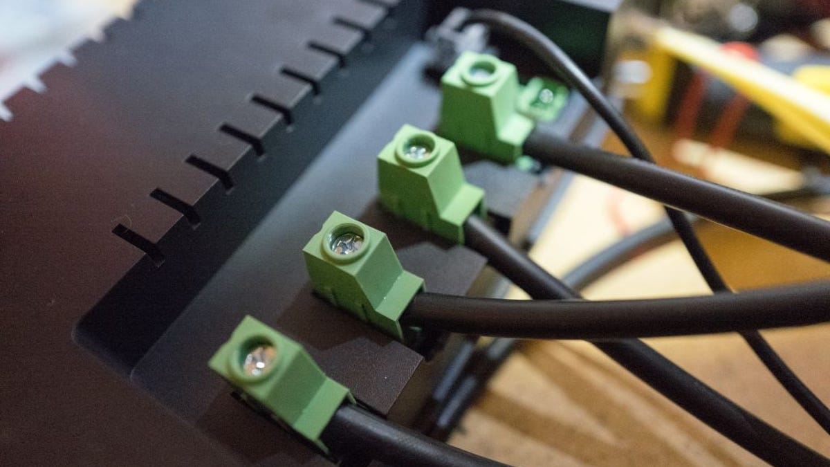 Wires connect to the back of a solar charge controller.