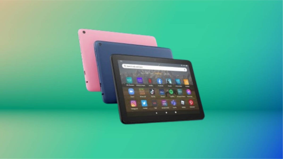 Trio of pink, blue and black Amazon Kindle Fire HD tablet displayed against a gradient green and blue background