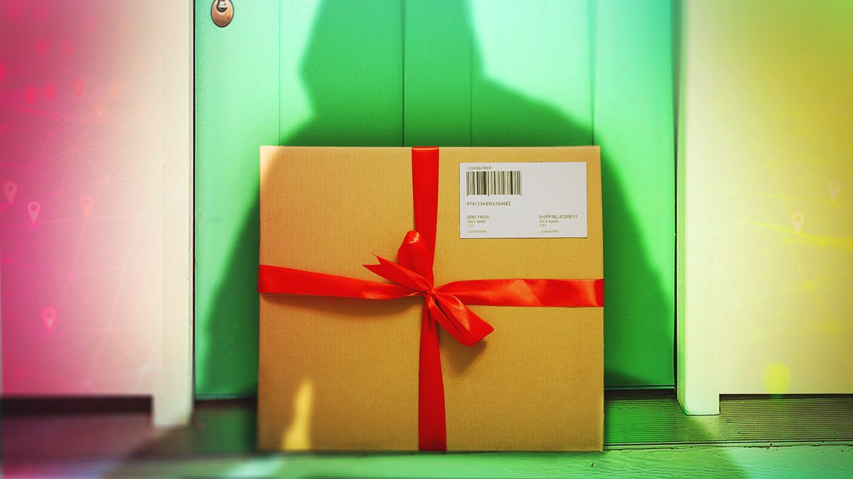A holiday package sits at a door with a hooded shadow over it.