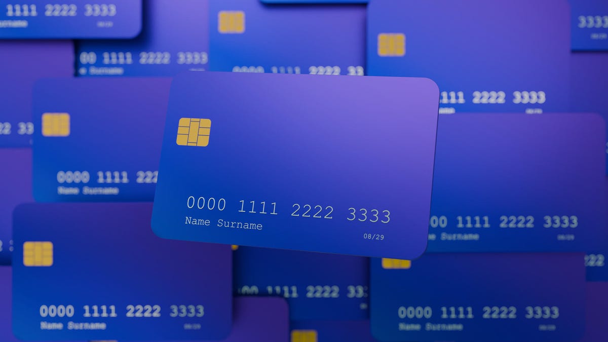 Purple credit cards layered on top of each other
