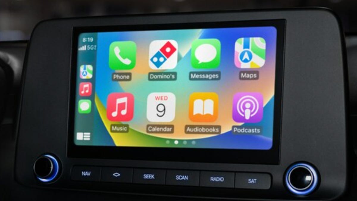 Apple CarPlay screen showing the Domino's app, as well as apps for phone calls, messages and maps