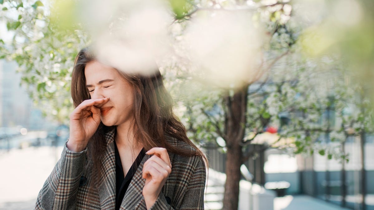 Woman Sniffling Outside Due to Seasonal Allergies