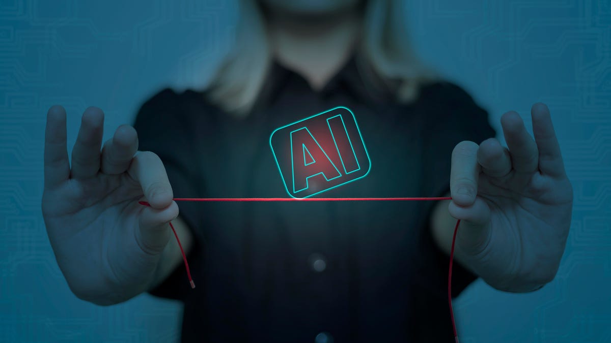 Woman's hands hold AI symbol balancing on a thread