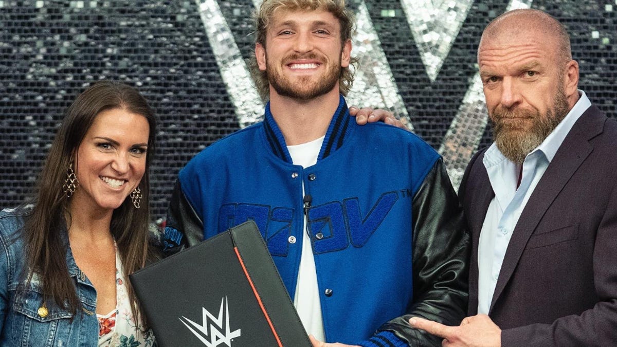 logan paul holding a contract with triple h and stephanie mcmahon