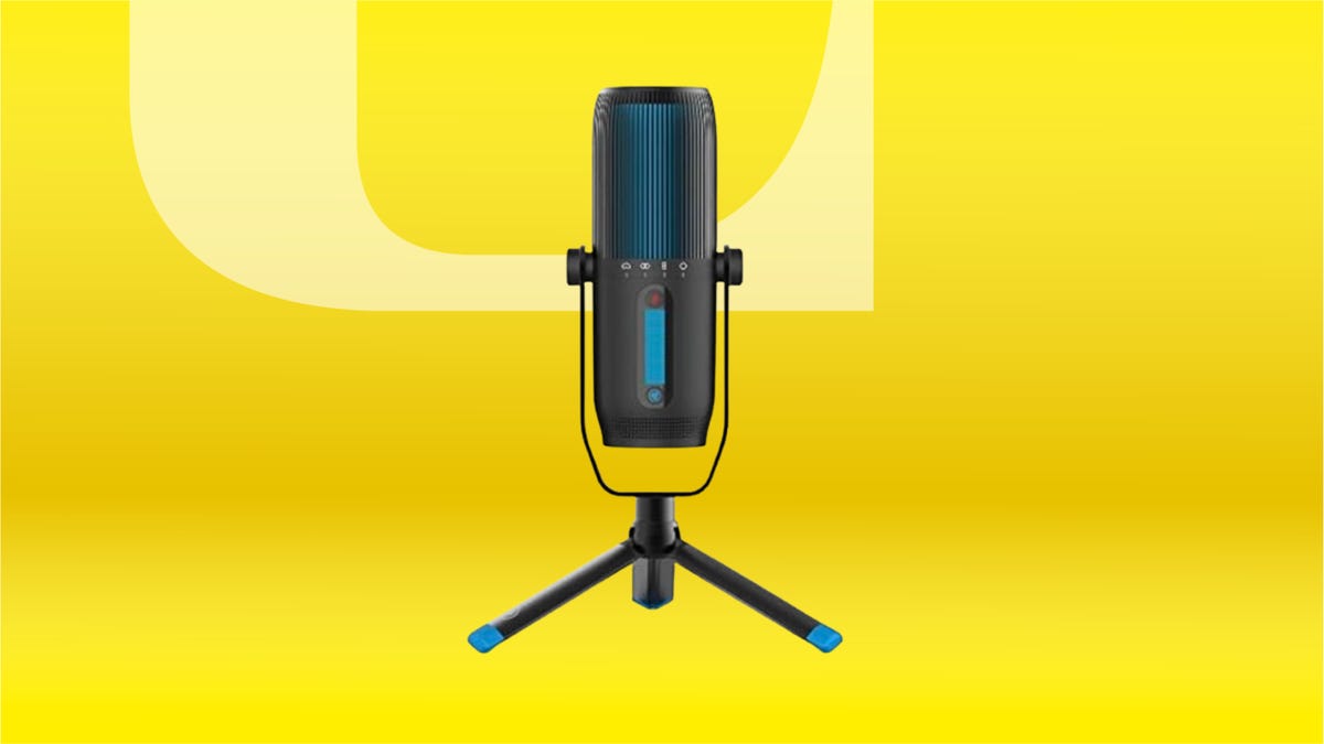 Black USB microphone against yellow gradient background.