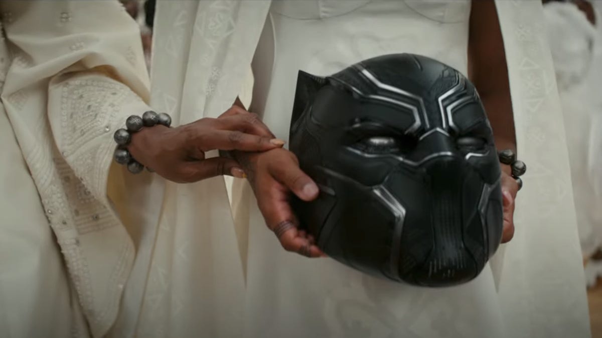 the black panther mask being held