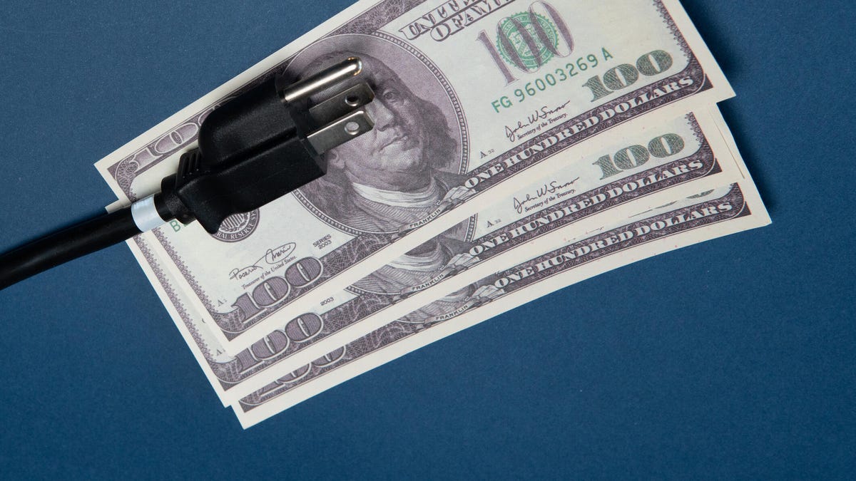 USA type B plug lies on dollar banknotes