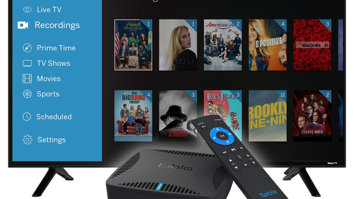 Tablo ATSC 3.0 Quad HDMI DVR and remote in front of TV