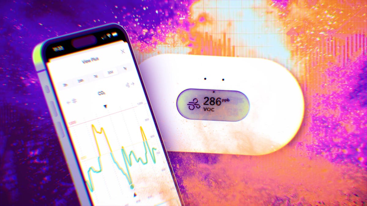An air quality monitor and the app on an iPhone.