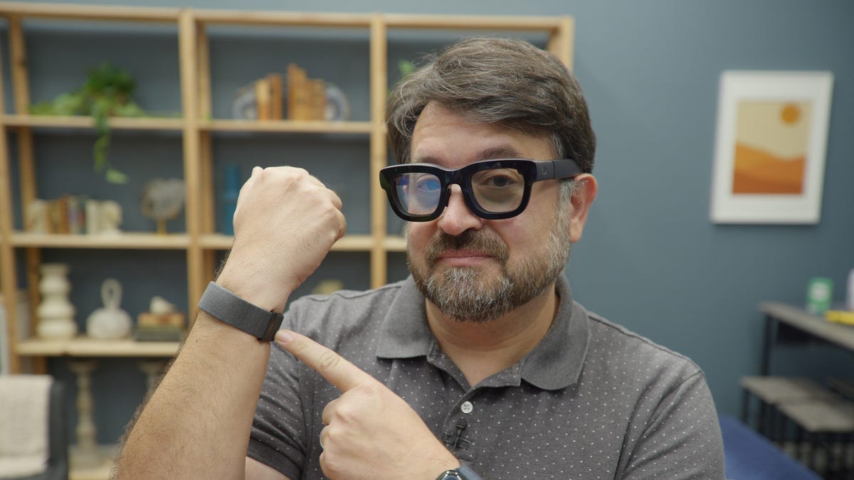 Wearing Meta Orion AR glasses and a wristband
