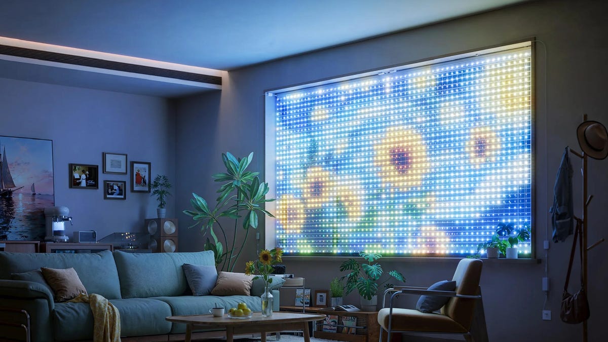 Govee curtain lights showing a flowery display in a dark living room.