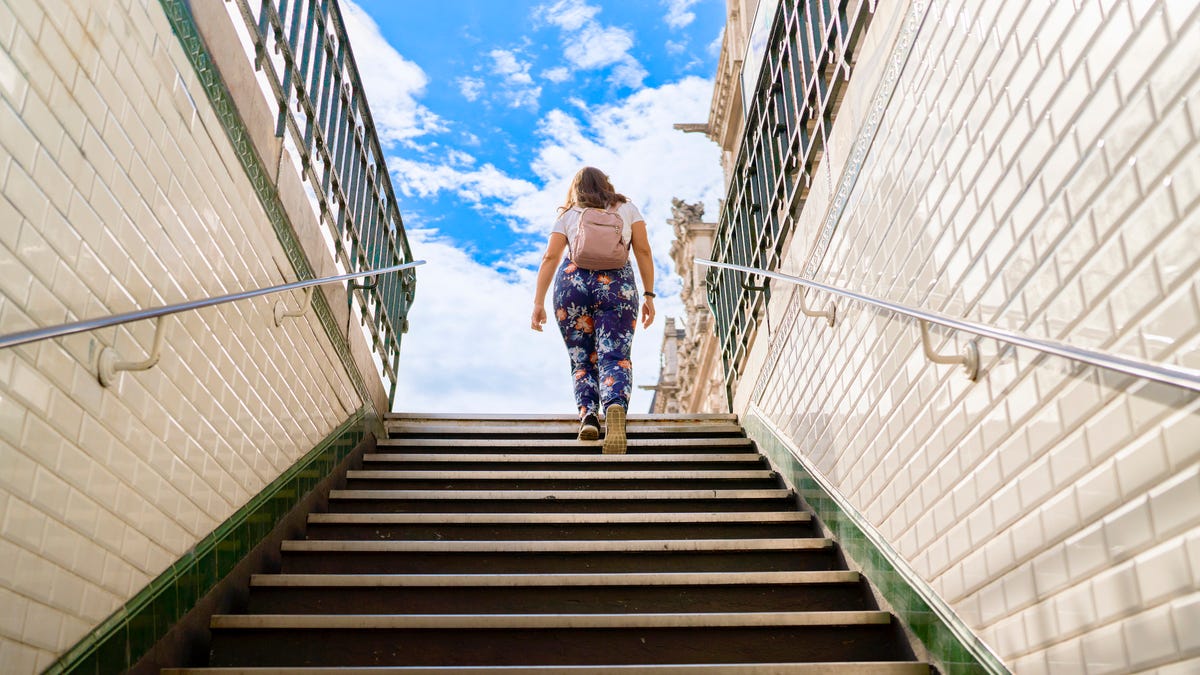 Person climbing subway stairs