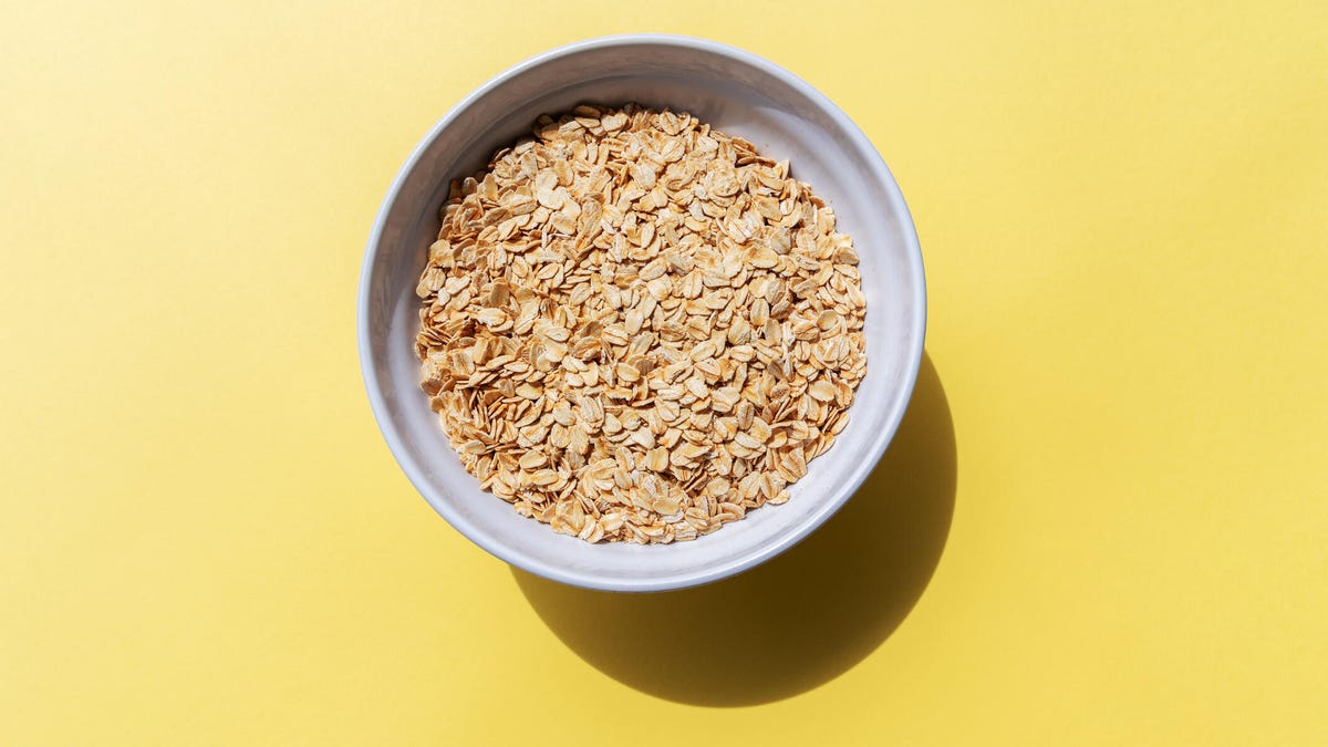 A bowl of oatmeal against a yellow background