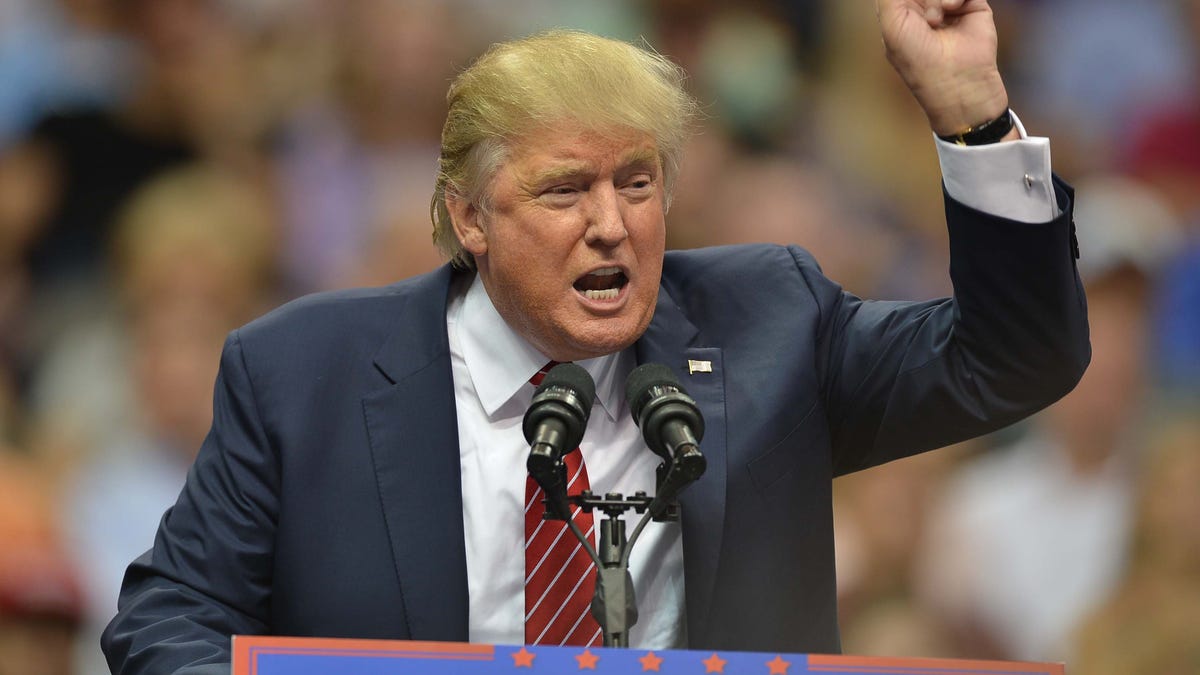 Donald Trump speaking at a political rally.