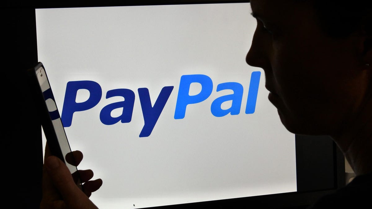 woman over PayPal logo