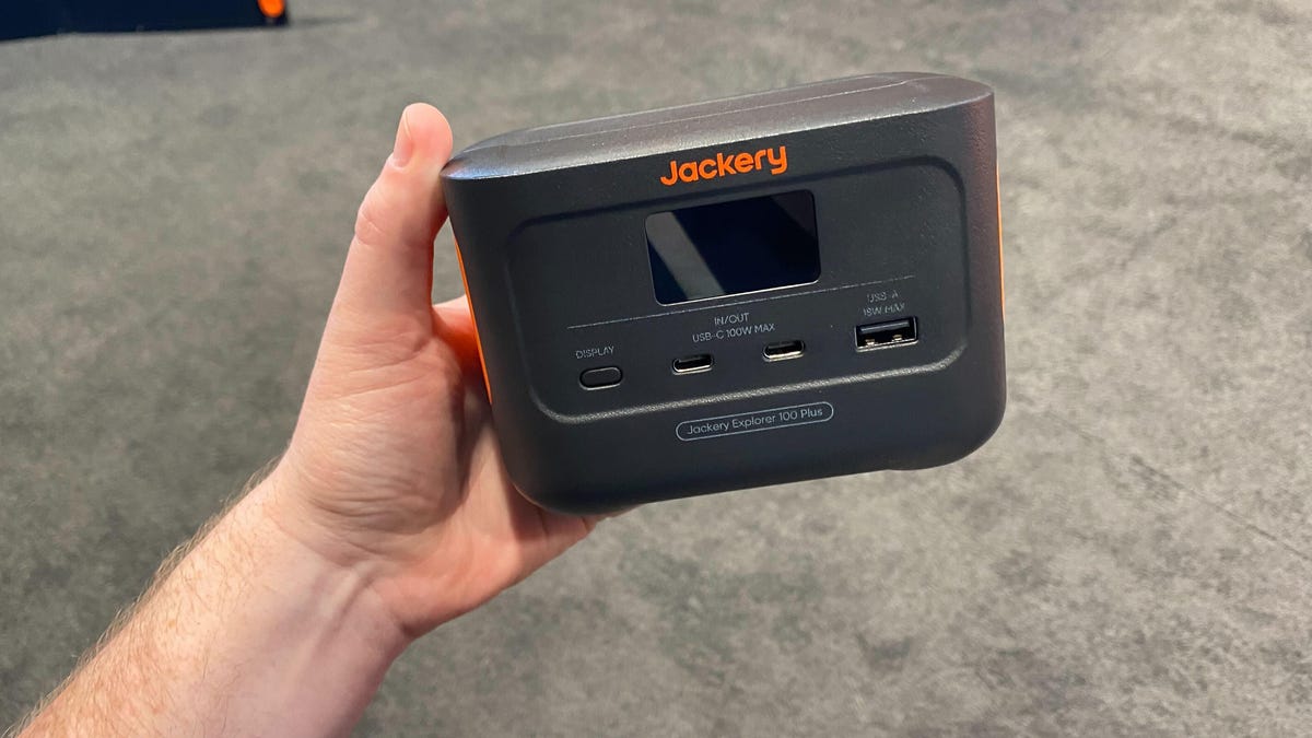 The author holding a small portable power station.