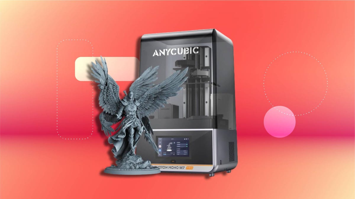 Anycubic Photon M3 3D printer with transparent front panel and digital display, shown alongside a detailed winged humanoid figure on a circular base. Set against a red and orange gradient background with abstract shapes.