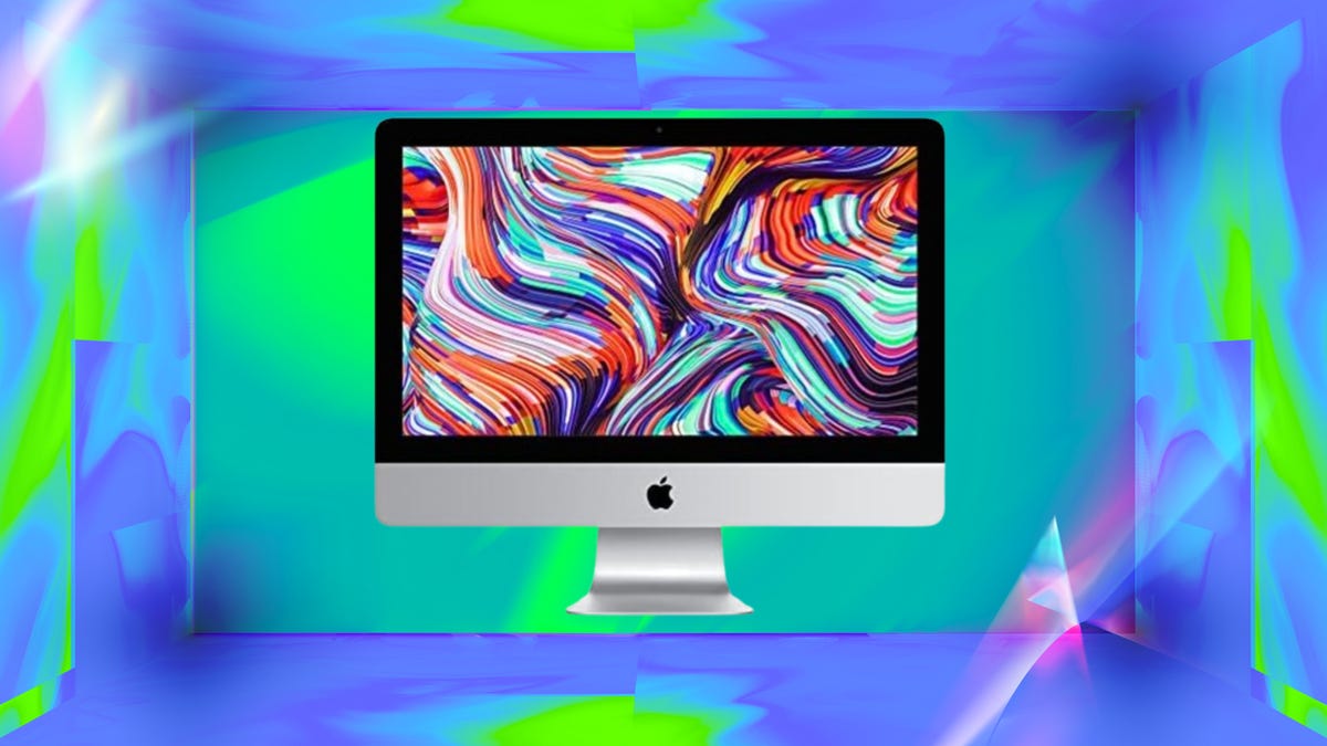 MacBook Air M3 with dark maze-like pattern on screen, on a rainbow gradient background