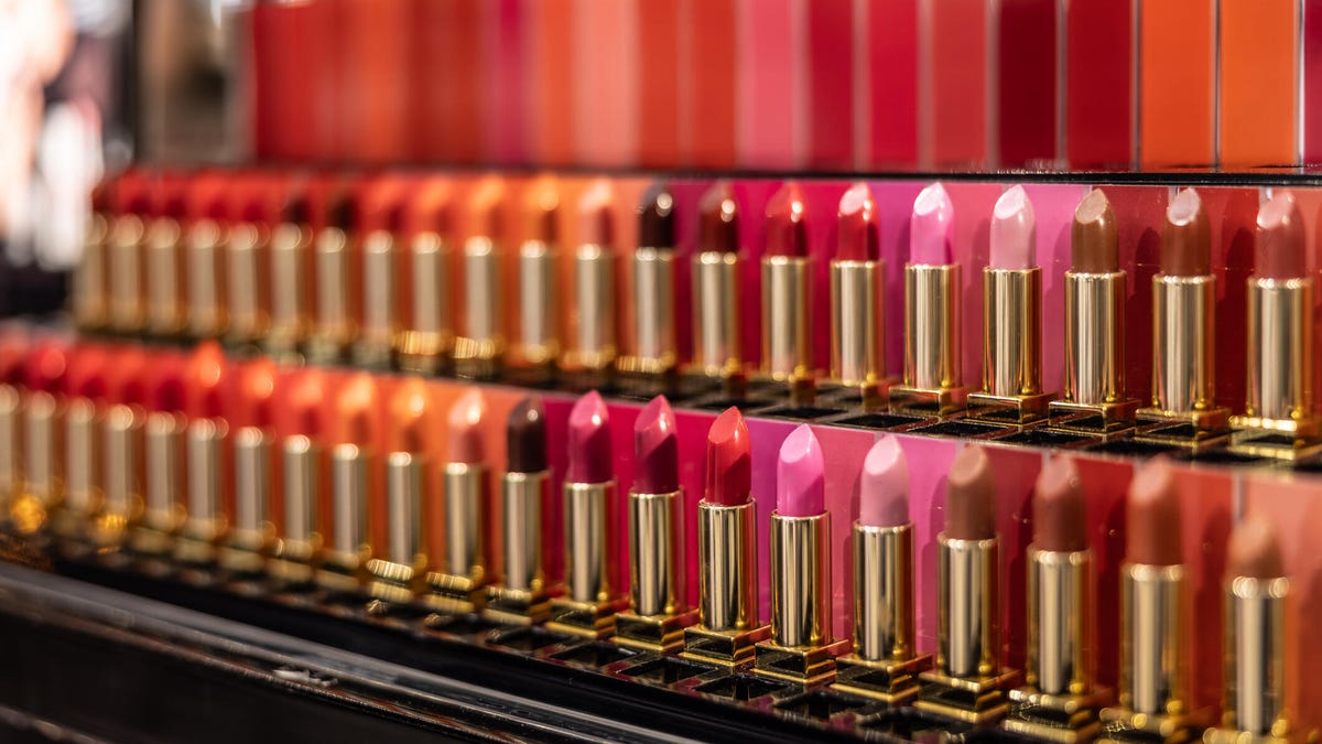 A photo of a display of lipsticks in many colors