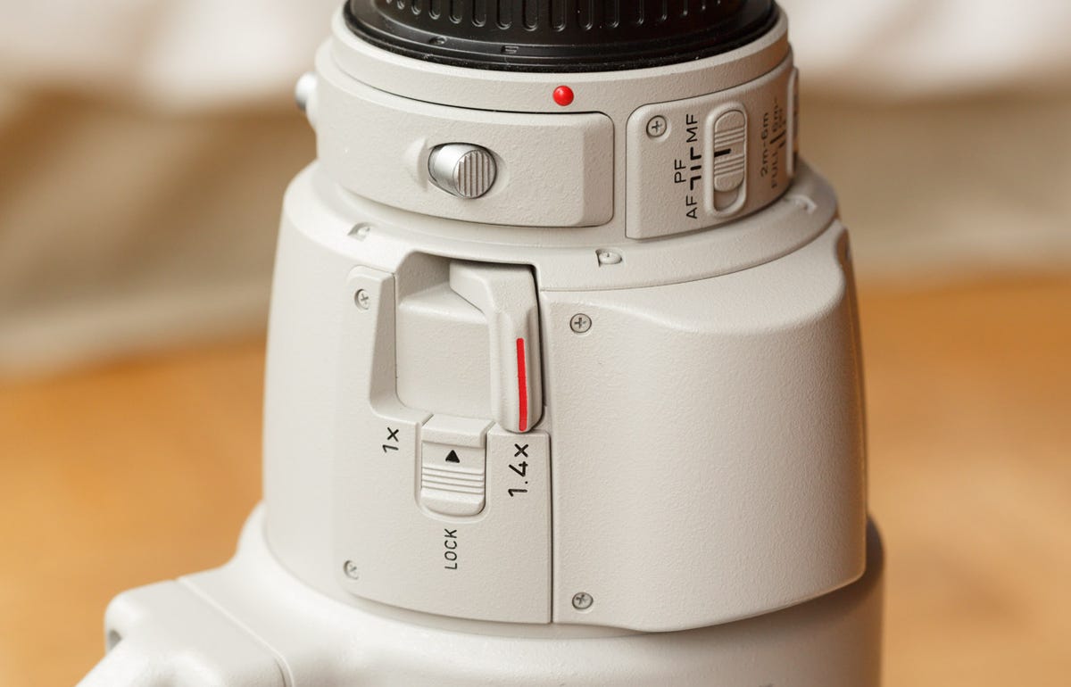 The standout feature of the Canon EF 200-400mm f/4L IS USM Extender 1.4x lens is a built-in 1.4x telephoto extender. It's operated by flipping a lever near the camera end of the lens. The feature comes at a cost: the lens has a suggested price of $11,799 and weighs 8.3 pounds.