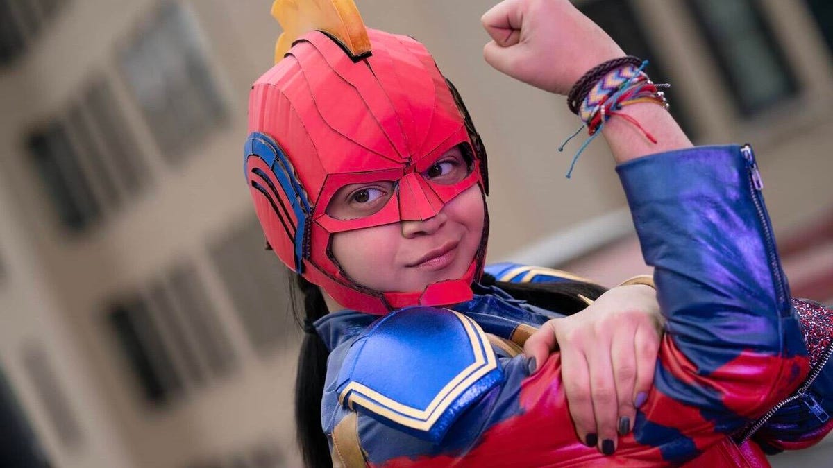 ms marvel in mask flexing biceps