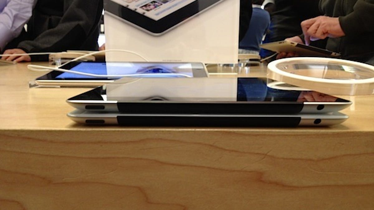 Though some people I talked to on Friday said the new iPad (top) was definitely heavier and thicker than the iPad 2 (bottom), I was pleasantly surprised at how similar--as in almost identical--the two were.