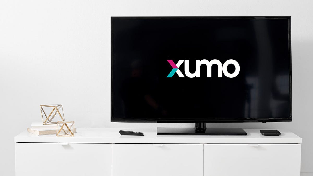 Xumo logo on TV screen perched on a stand