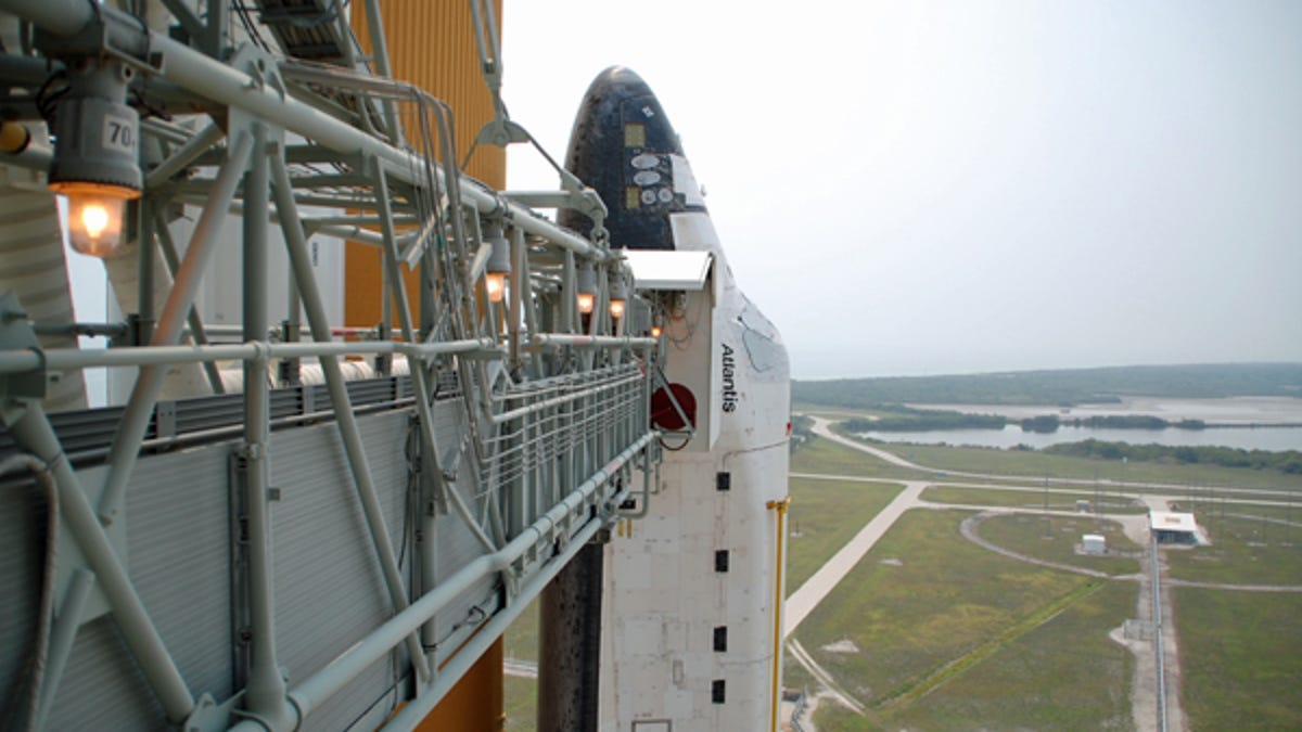 The space shuttle Atlantis stands ready for its final mission.