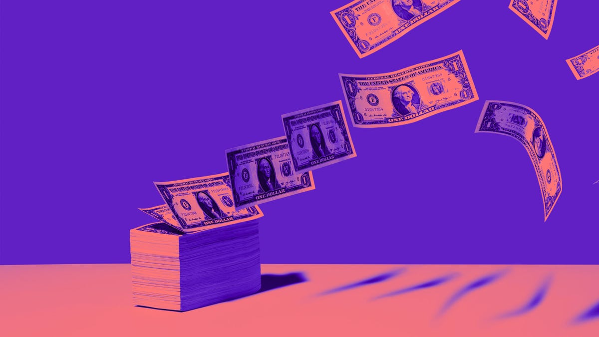 cash flying off a stack