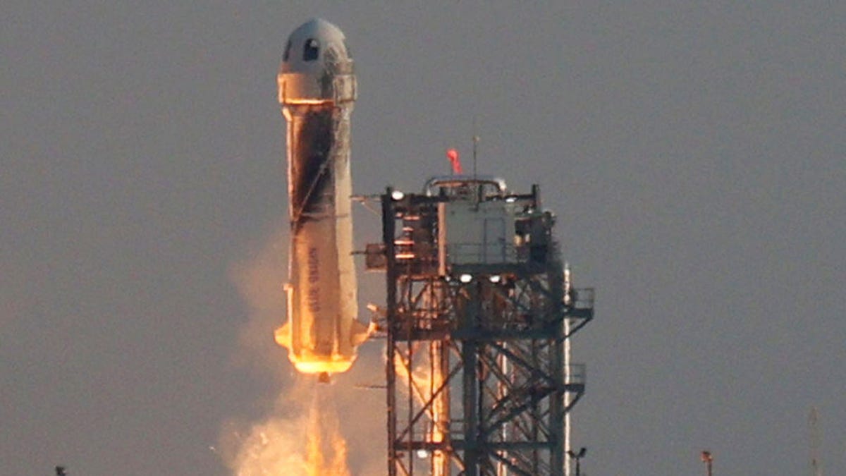 Blue Origin's New Shepard rocket lifts off, July 20, 2021.